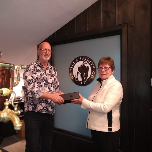 number63hotel's tweet photo. Our Chairman Ann receiving the first bottle of bespoke Number 63 Gin from Andy Daniels @gorillaspirits It will be on sale after the AGM on 25 January full story here: https://t.co/vvNbIwG09k https://t.co/iW2YjuqRVA