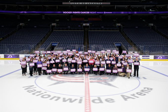 Riles2011's tweet photo. Tonight the #CBJ take the ice for #HockeyFightsCancer Night. Our staff united for a group photo before the game. Learn more about how #CBJ support the cause https://t.co/9mFO2ZWNAU https://t.co/KpNjrLCReS