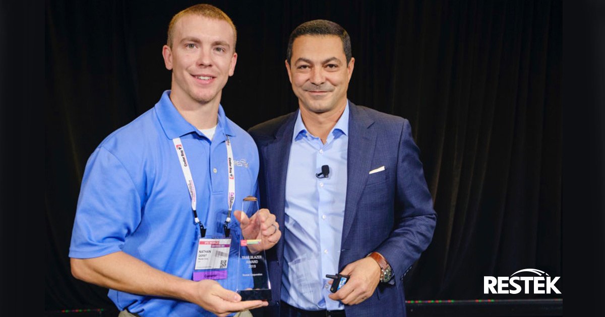Restek's tweet photo. The @ifs Chief Customer Officer Michael Ouissi presents the “The Trailblazer–Team Award” to Nathan Gerst of @Restek in front of 3,000 people during the #IFSWoCo19 on Oct. 9 in #Boston for the team’s innovative implementation of its ERP product. #IFS #IFSWorldConference https://t.co/g0UJrZb9DQ