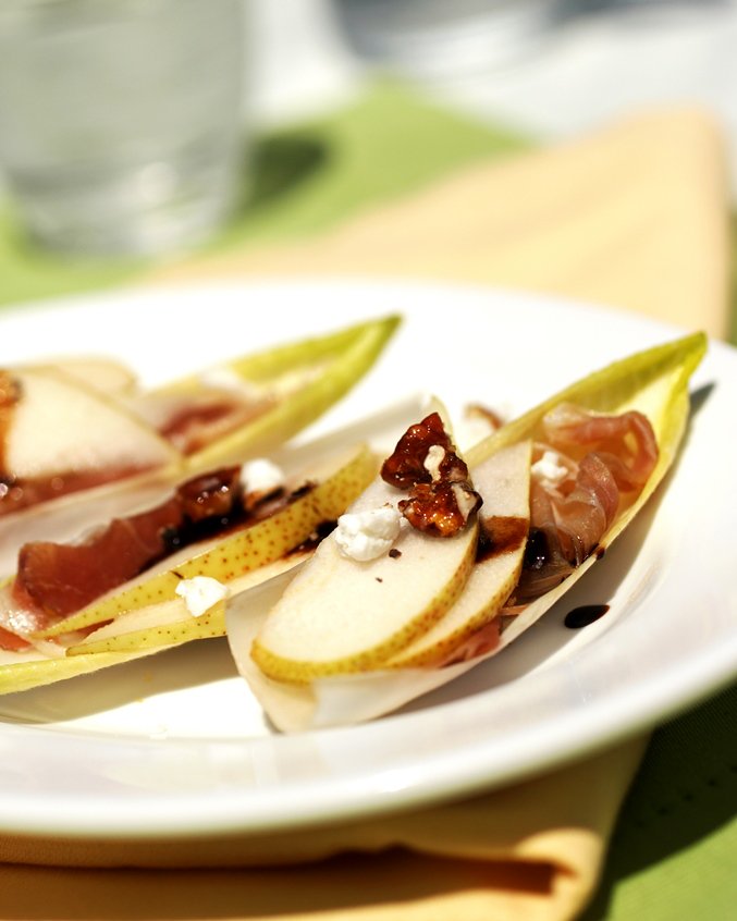 Get in holiday mode with this simple yet elegant appetizer! Ontario pear, pecan, prosciutto and cheese, topped with balsamic drizzle - absolutely bursting with flavour! #ontariopear #ontariopork #ontariodairy #appetizer #entertaining #holidaymode #snack #burstingwithflavour