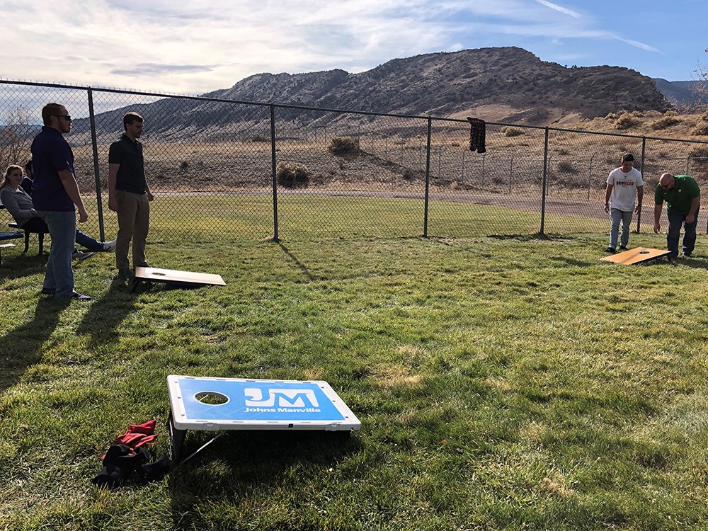 JohnsManville's tweet photo. We wrapped up Customer Service Week with our annual cornhole tournament. Two teams from our @JMRoofingSystem business went head to head in the finals. Thank you to all of our service teams for delivering the JM Experience to our customers! #WeAreJM #JMExperience https://t.co/QkvdJlf0e7