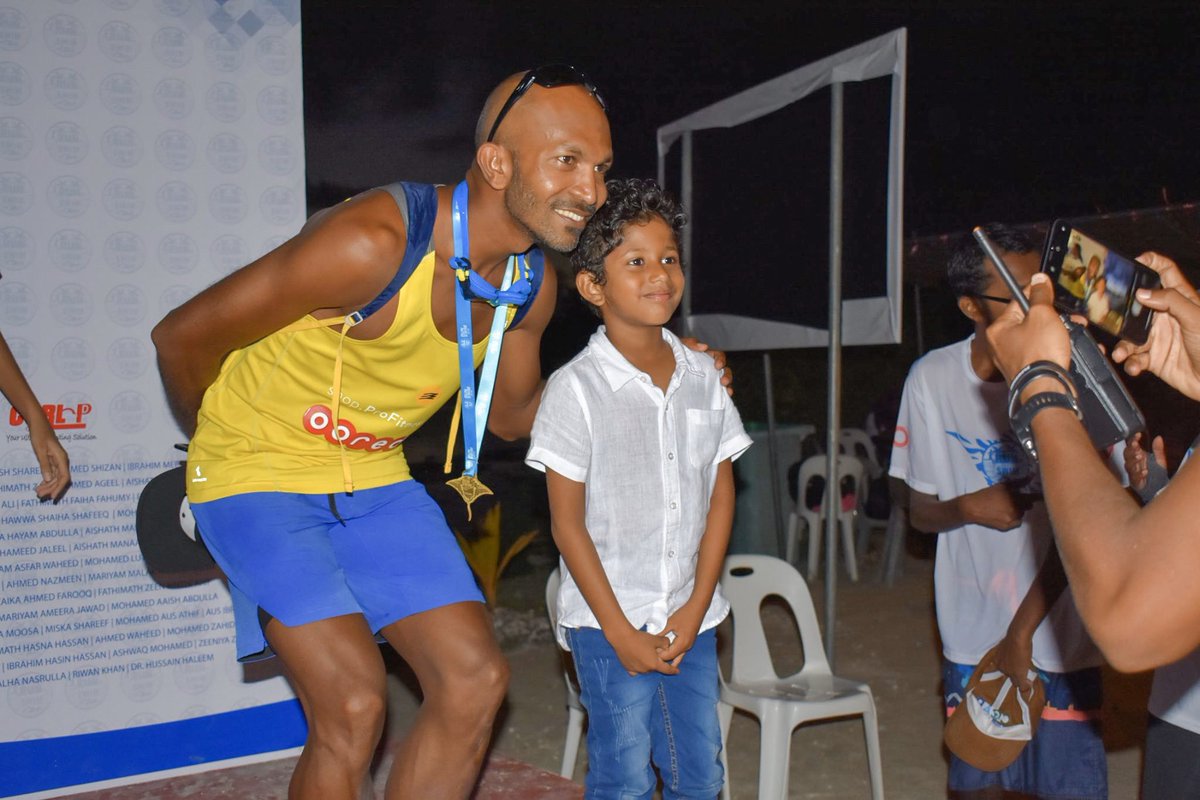 hammettz's tweet photo. This boy asked if I was a “swimmerman”. I said I’m a runner. And he said that you are a “runnerman” and a “swimmerman” 🏊🏽‍♂️ 🏃🏾‍♂️ 

📷 Arif  #runswimaddu 
@OoredooMaldives @ProFitness_MV https://t.co/BS2ry8vh2h