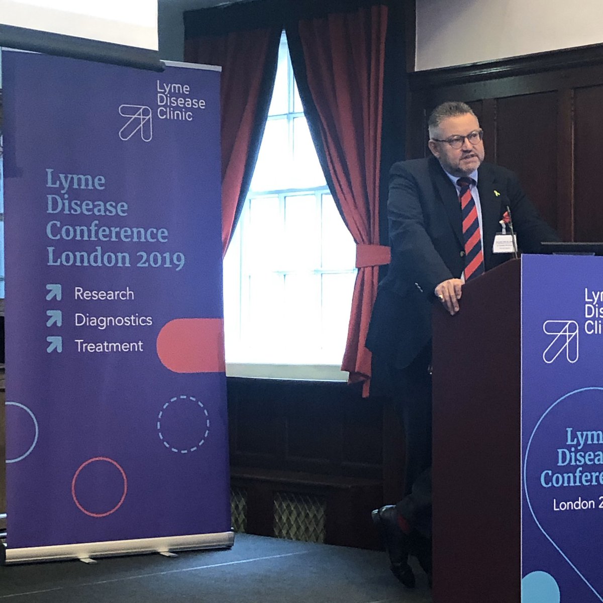 IVBOOSTUK's tweet photo. Dr Carsten Nicolaus takes the stage  at the Lyme Disease Conference and stresses the importance of an early diagnosis in successfully treating Lyme Disease. #callingtimeonlyme
#lymediseaseclinic #drjosh #lymedisease #treatment #research https://t.co/ebpgpuVvz8