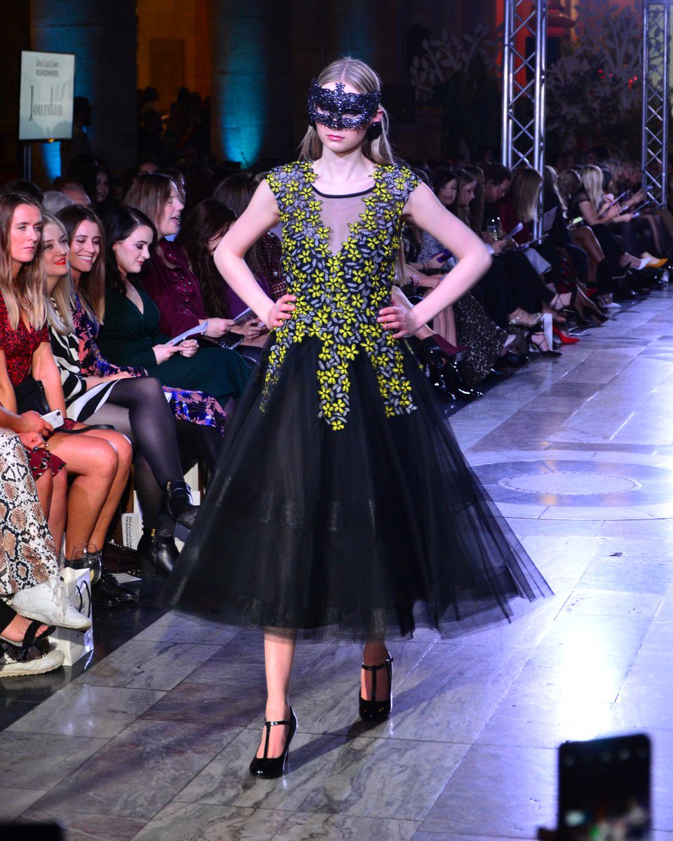 A gorgeous midi length dress from #CarlaRuiz with yellow flower applique and a tulle skirt - perfect for a #NYE ball! #GoodbuyJourdan