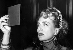 AllTC_'s tweet image. Joan Crawford checking her makeup before filming a scene for 'Flamingo Road' 1949.