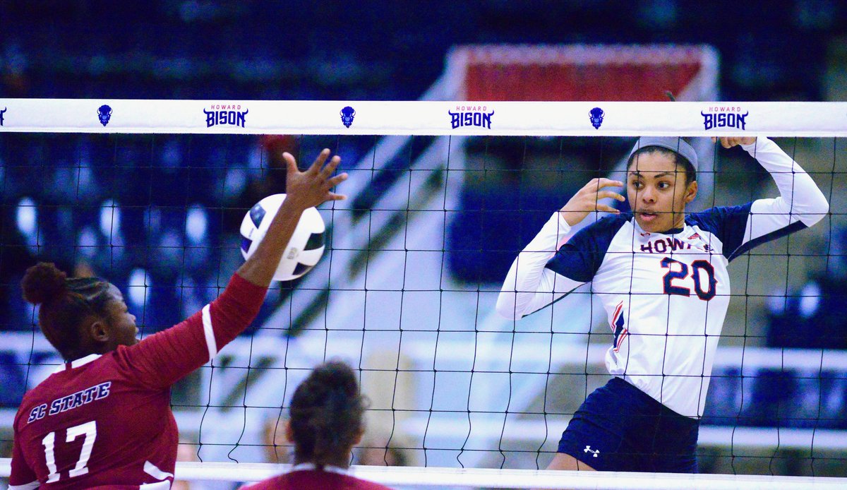 edwardcjones3's tweet photo. @HUBisonVB's #20 middle blocker Ana Williams eyes her execution across the net as @SCStateAthletic's #17 Aundrea Boyland responds at Friday night's game (Senior night) at @Howardu's #TheBurr. @HUBisonSports won in 3 straight sets. @MEACSports #HBCU #Volleyball https://t.co/KwWEHg4gxn