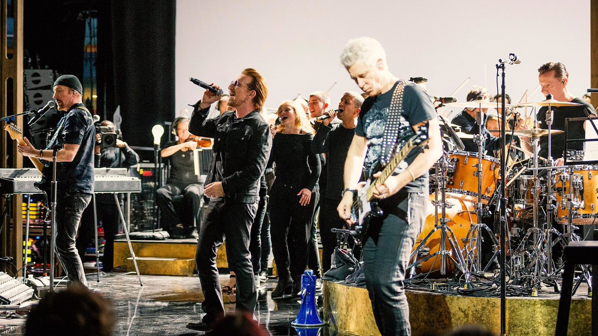 U2start's tweet photo. One year ago today U2 recorded an amazing night of music at the BBC with a choir and orchestra. What's your favourite performance from this night? 💞 https://t.co/6fW9bOJ0Kr