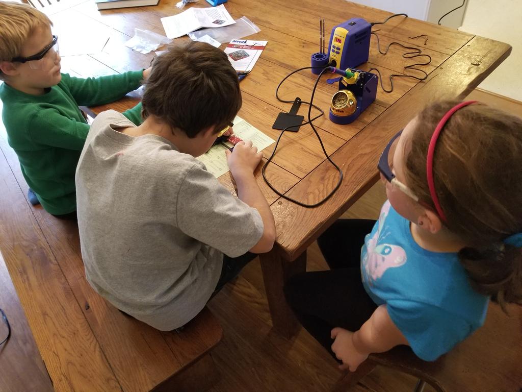 forsythebrf's tweet image. Teaching some some kiddos soldering using @HakkoUSA and building a light board.