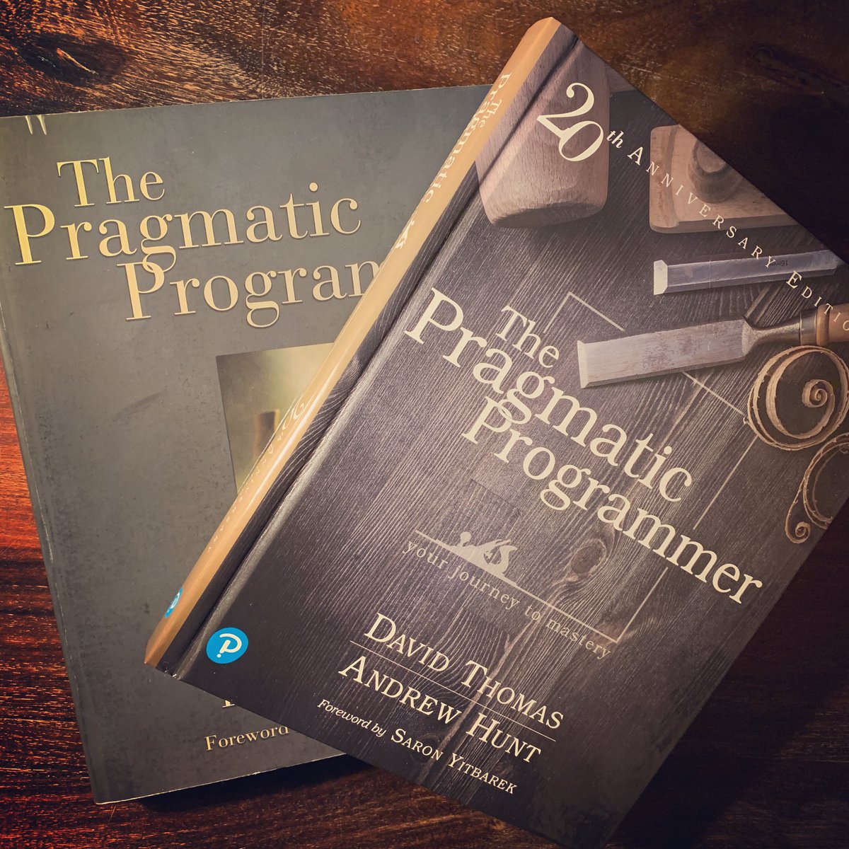 frededison's tweet image. A true classic: #ThePragmaticProgrammer. My original copy and the 20th Anniversary Edition side by side.