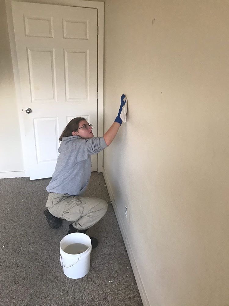 Blue 4💙 team from AmeriCorps was helping paint houses for Sabin CDC and he a fun time doing it