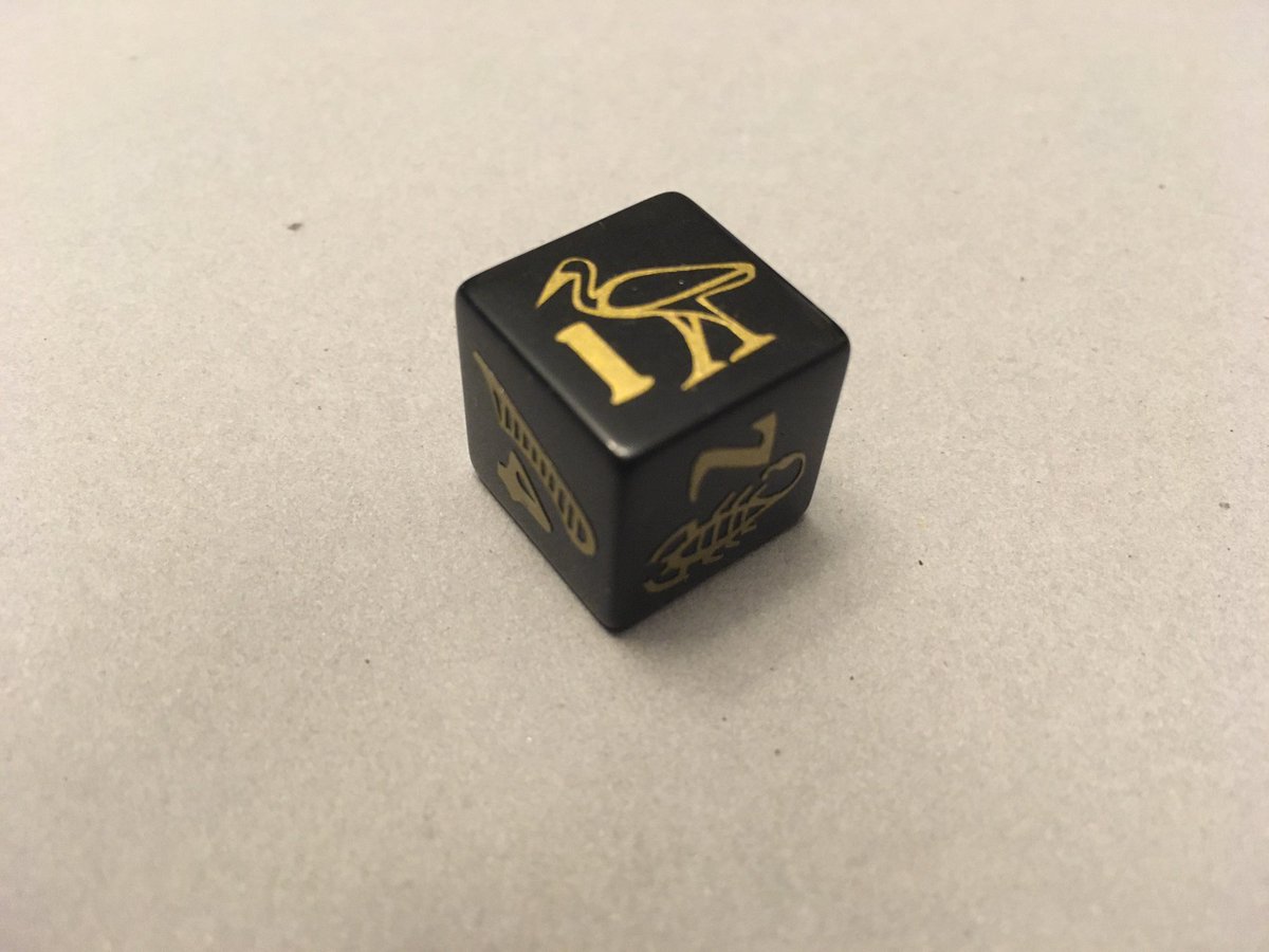 Since I finished my Data Arcana yesterday, putting together a  #dnd dice set for Inhapi, my grave domain cleric who follows the ancient Egyptian pantheon. Here’s the d6! Each symbol has a meaning that corresponds to one of the ability stats.