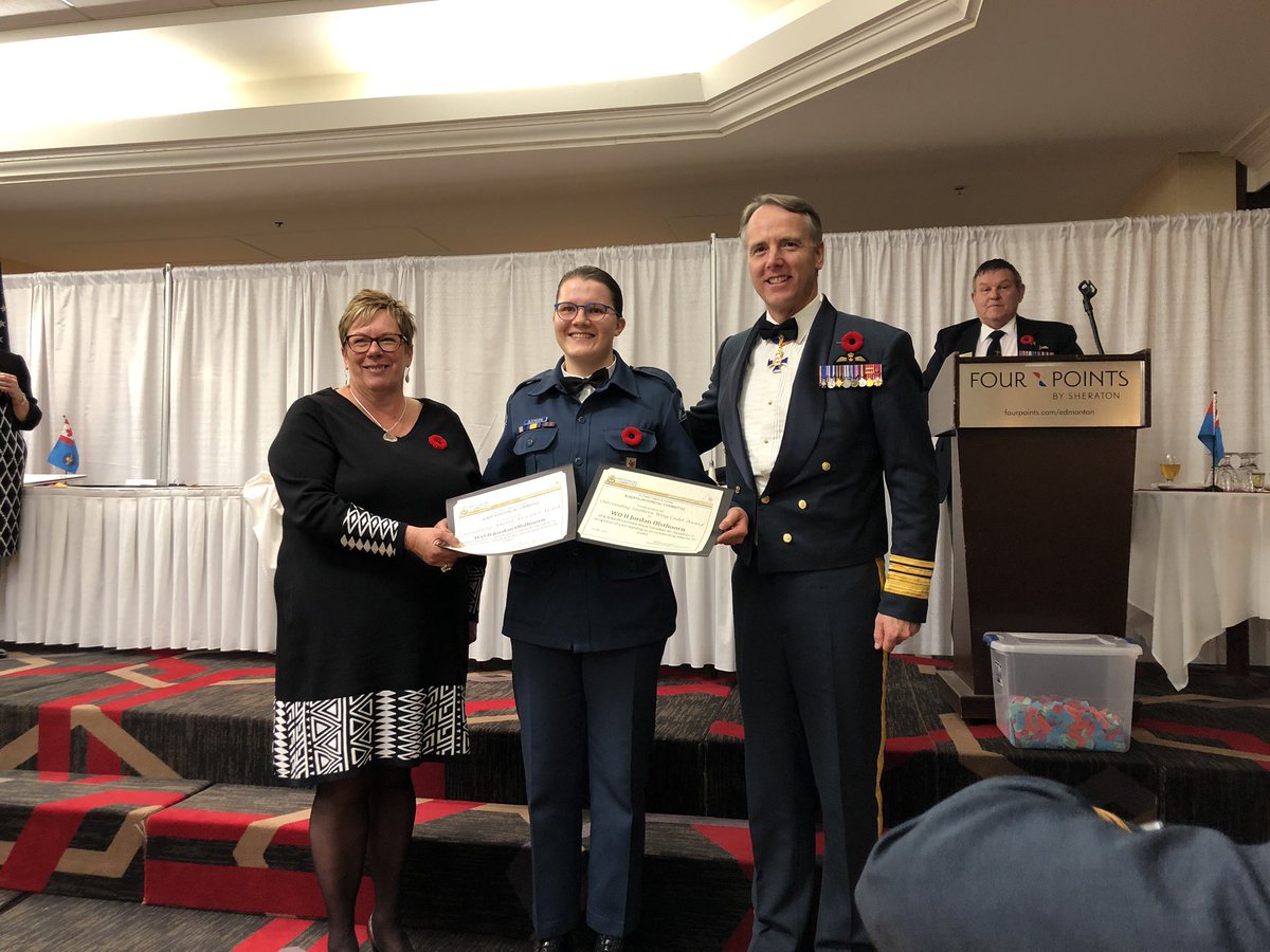 AirCadetAlberta's tweet photo. Rhonda Barraclough Chair @AirCadetAlberta along with guest speaker LGen Al Meinzinger Commander @RCAF_ARC present the Top Cadet Award to WO II  Jordan Olsthoorn of 878 Banff-Canmore Sqdrn during the Alberta Provincial Awards Banquet @cadetsca @AirCadetLeague https://t.co/jFM1LbRjlR
