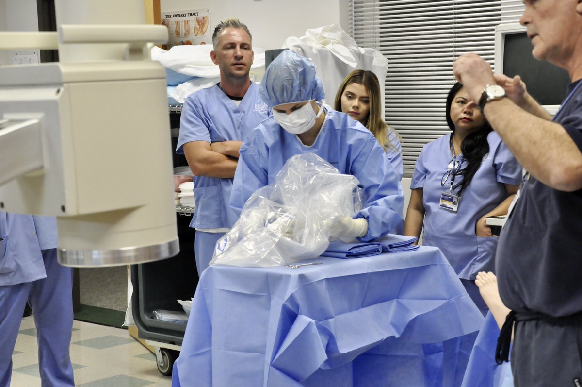KeiserU's tweet photo. KeiserU #Tampa collaborated with #Clearwater Campus in a #workshop where the #RadiologicTech Program and #SurgicalTech Program simulated a surgical suite scenario. The students all worked together to sterile drape the c-arm in preparation for #fluoroscopic guided imaging. https://t.co/HbFLEr3meD
