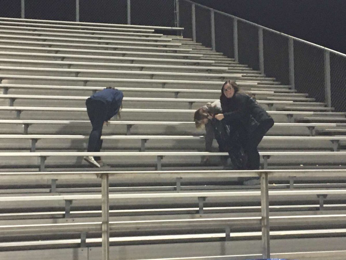 Cleaning up trash after the football game Friday!