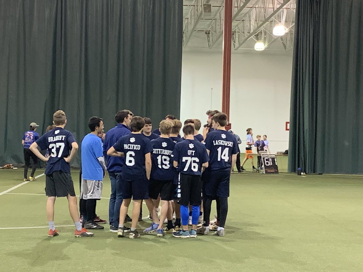 Spirit circle after a 11-6 victory against Traverse City High School