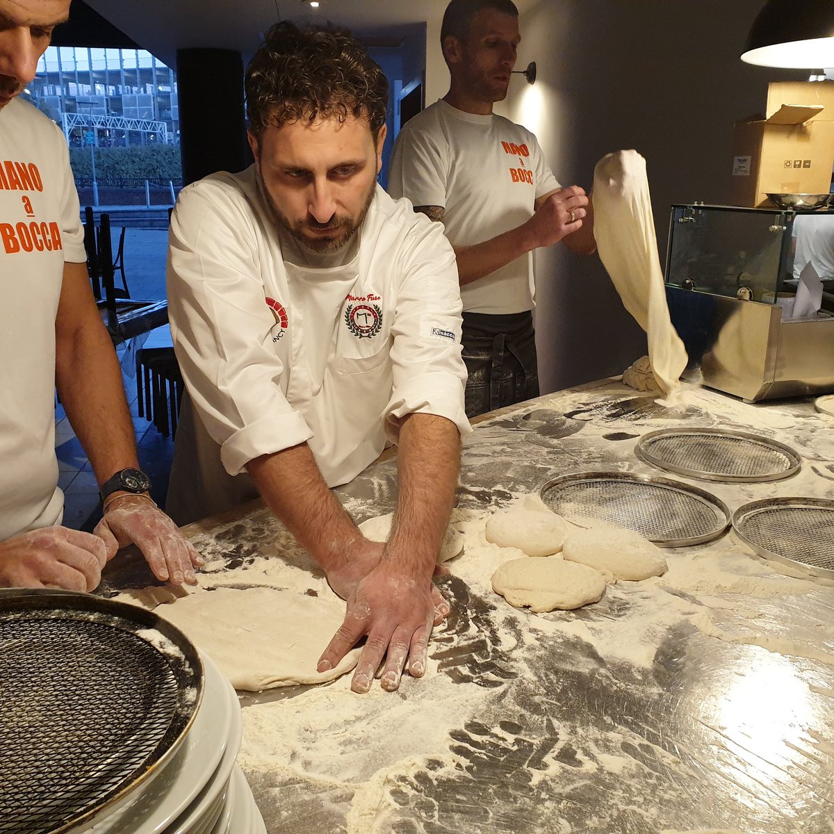 ManoBoccaPizza's tweet photo. Dough masterclass underway with #MarcoFuso creating a bespoke pizza recipe for our new Romana restaurant. #masterclass #pizza #pizzadough #italia #Romana #salemanchester https://t.co/XXcfwjUjGx