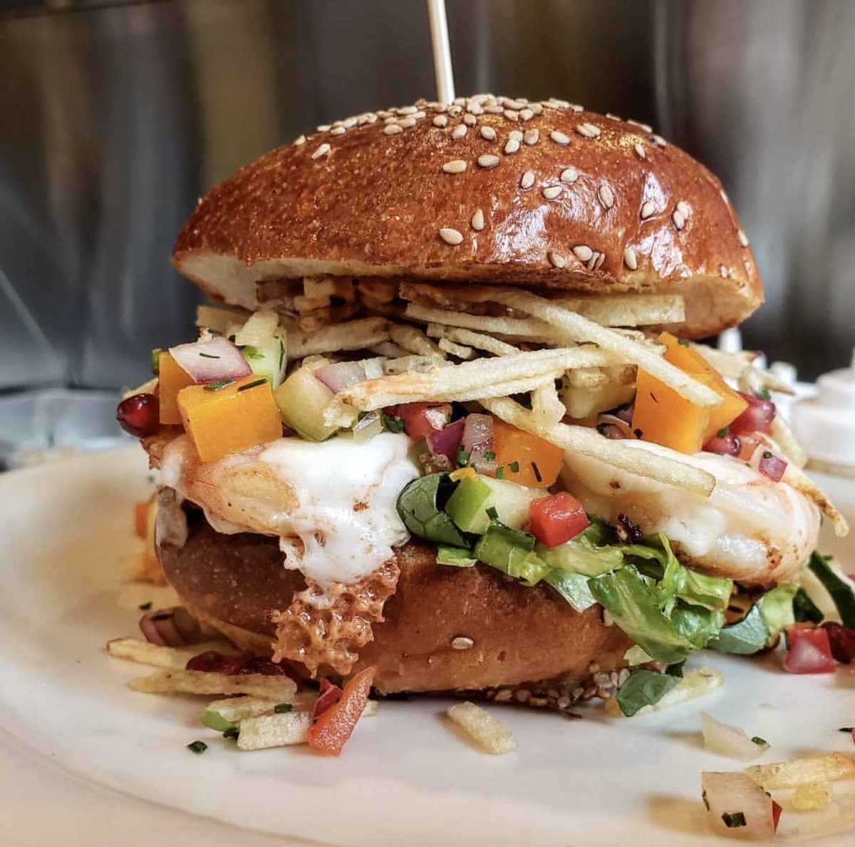 AmericanSardine's tweet photo. The Oaxacan Shrimp Burger sounds like your Monday Night plans. Grilled shrimp, Oaxaca Cheese, Fall Pico de Gallo, and Potato Stix on @BakerStBread Sesame Brioche https://t.co/0anN3Ea6iN