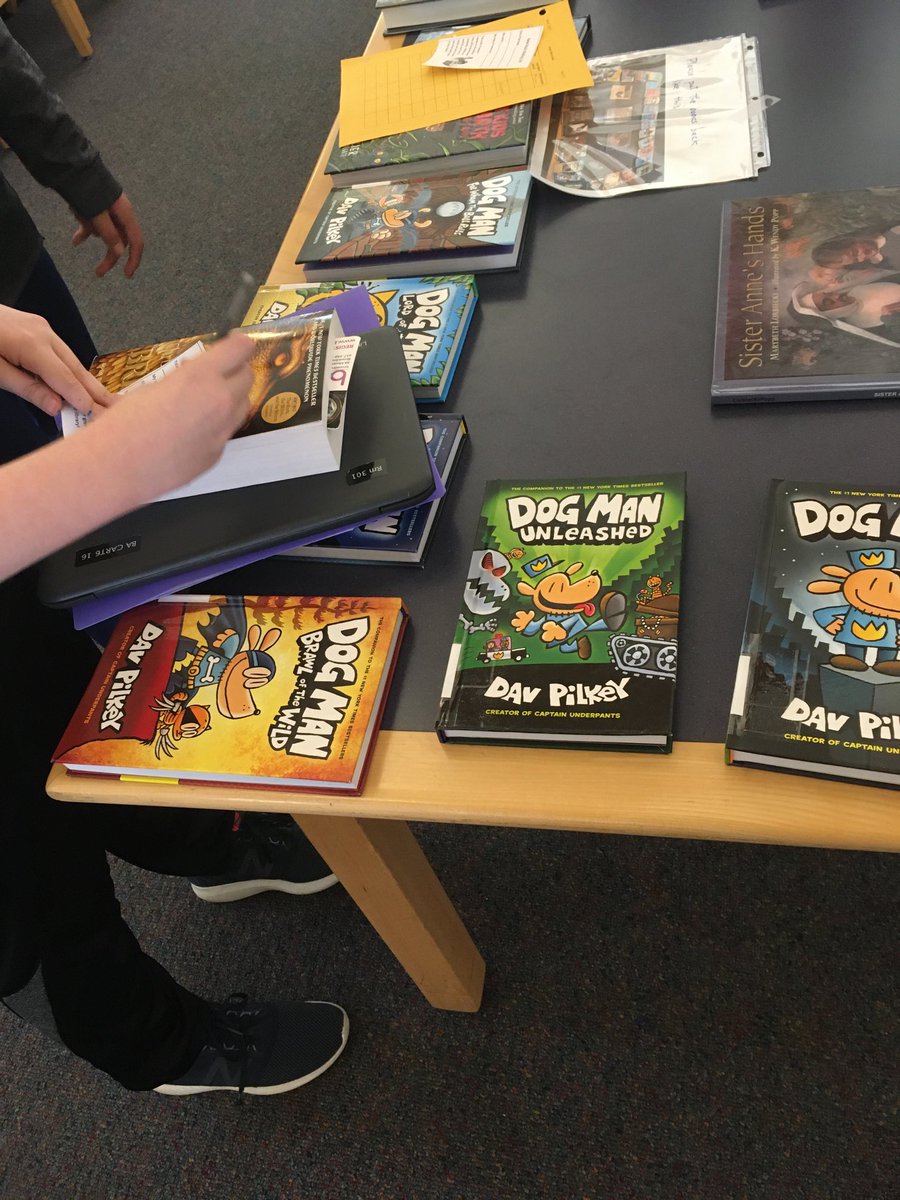 Scenes from our New Book Petting Zoo - students get to examine the new books and get on waiting lists for them. 📚💜