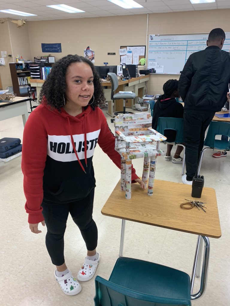 WestPortHigh's tweet image. West Port’s Engineering students are full of surprises. Who knew that they could design and build a chair out of newspapers that their Principal could sit in. #fieldtesting #lifeskills