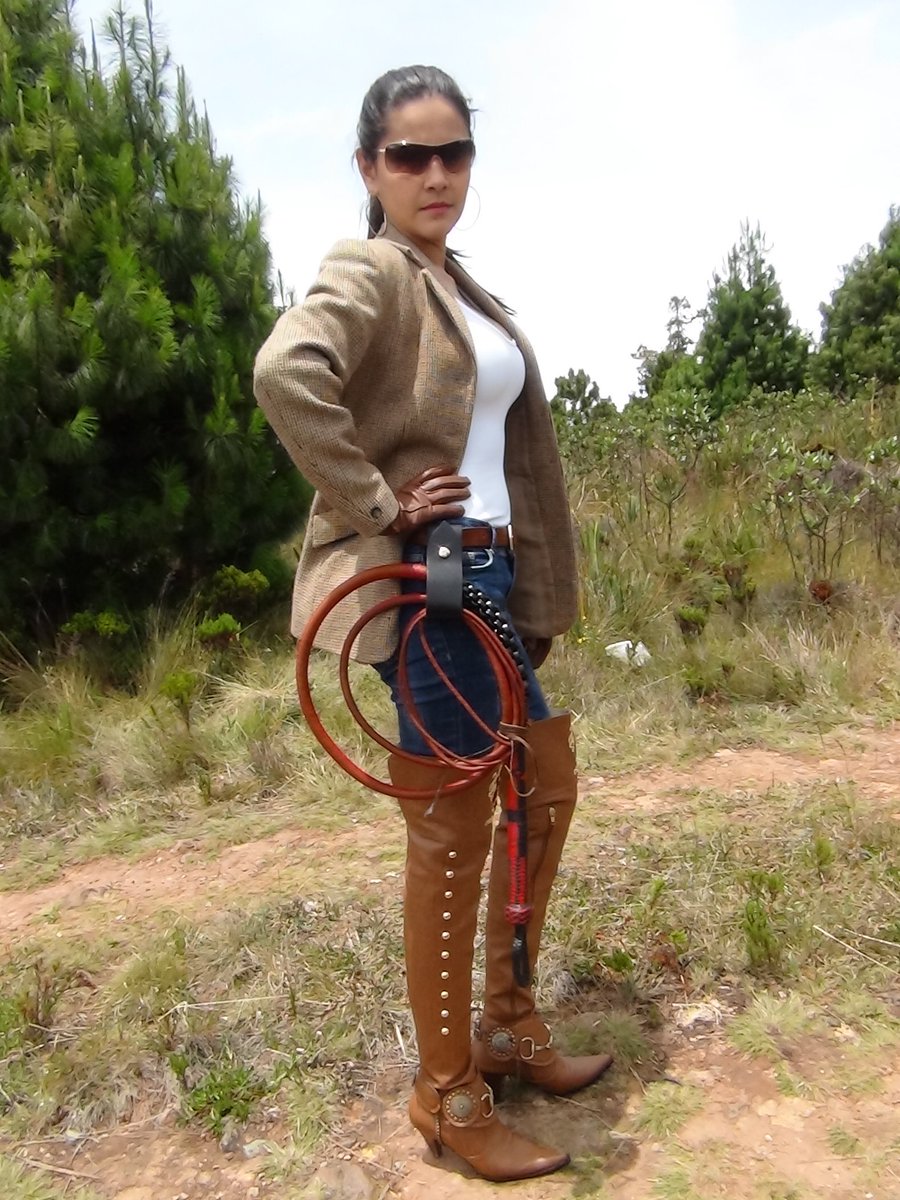 Slideshow mistress with bullwhip. 