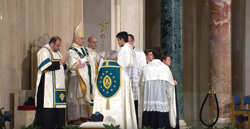 Now fully vested, the Archbishop, assistant priest, deacons, and subdeacon all wear—as ++Salvatore pointed out in his sermon—"a cloak of turquoise, an honor reserved to Aztec gods and the Aztec royal family," the color of the mantle Our Lady of Guadalupe chose to appear in.