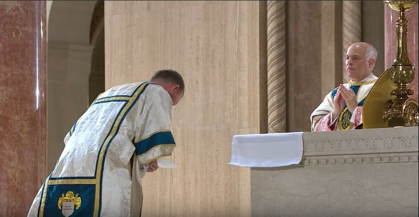 Before the distribution of Holy Communion, the Confiteor is chanted, as a final opportunity to repent of our sins, lest we approach the Sacrament unworthily. The Pontiff responds with prayers of pardon.