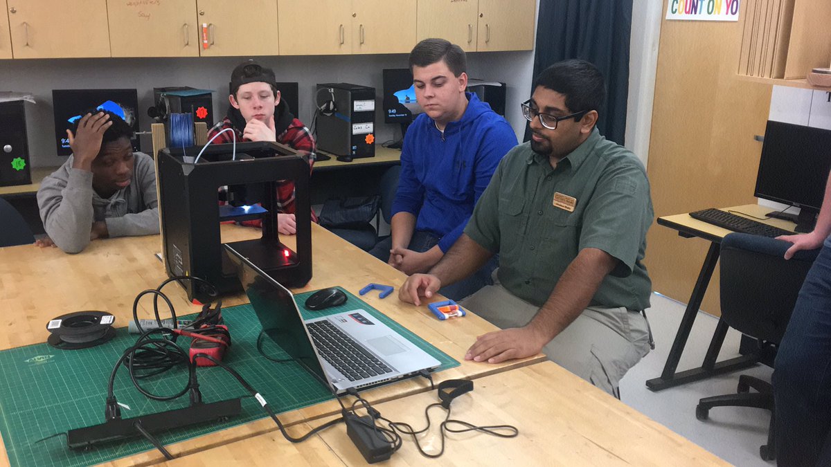 PHSTechEd's tweet photo. UMES intern Mr. Bhatty instructing ADA students in applying design and application of 3D printing. https://t.co/BkOWmh2a03
