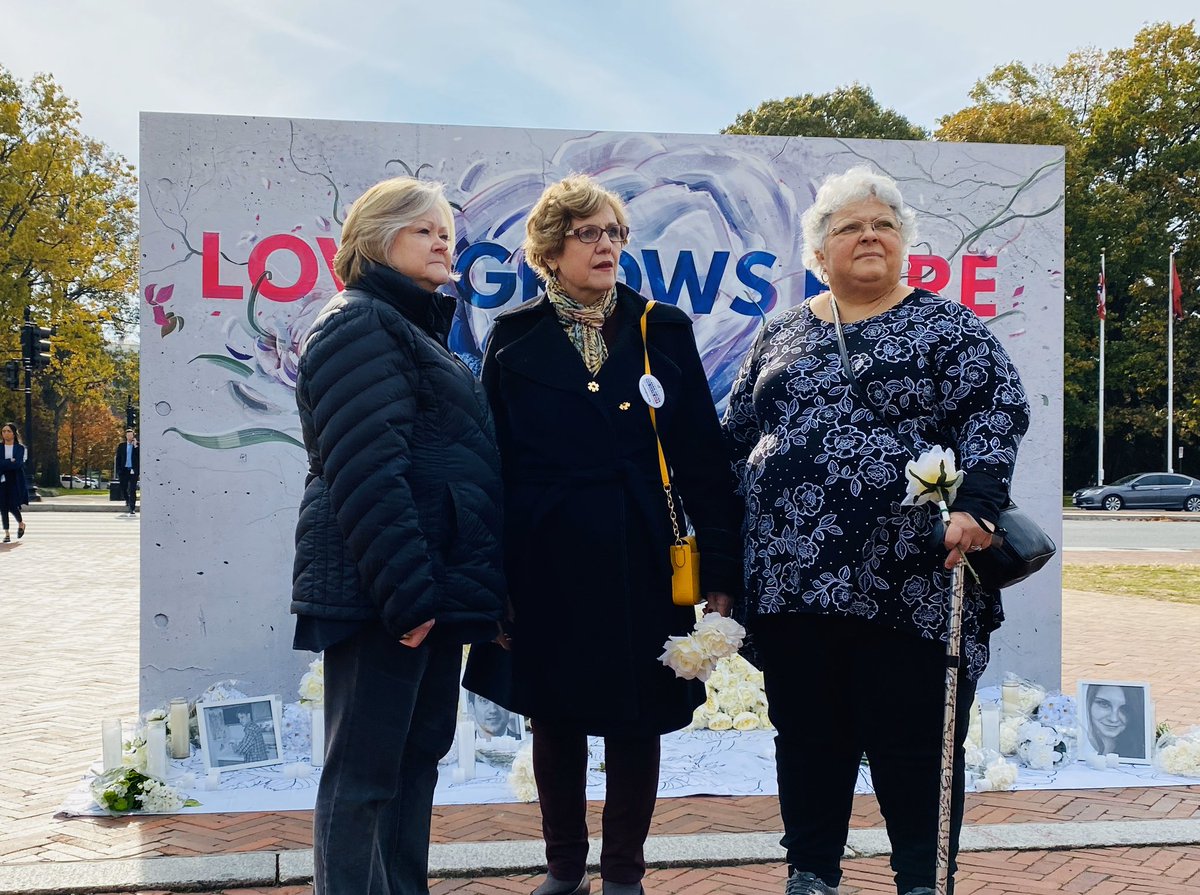 Judy Shepard, Haifa Jabara, and Susan Bro stand in front of our Love Grows Here mural.
