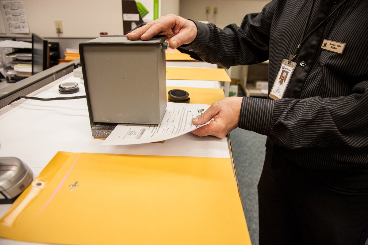 A worker at the King County Recorder's Office prepares a marriage license on Dec. 6, 2012.