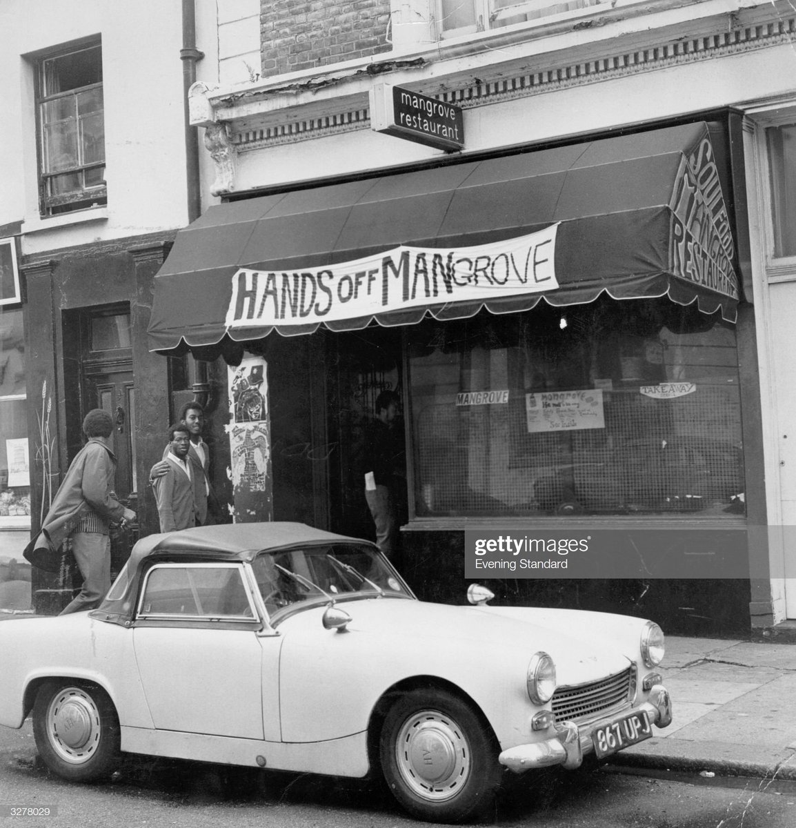 Folks outside the West Indian 'Hands Off Mangrove' restaurant in London, 1970. Photo by Evening Standard