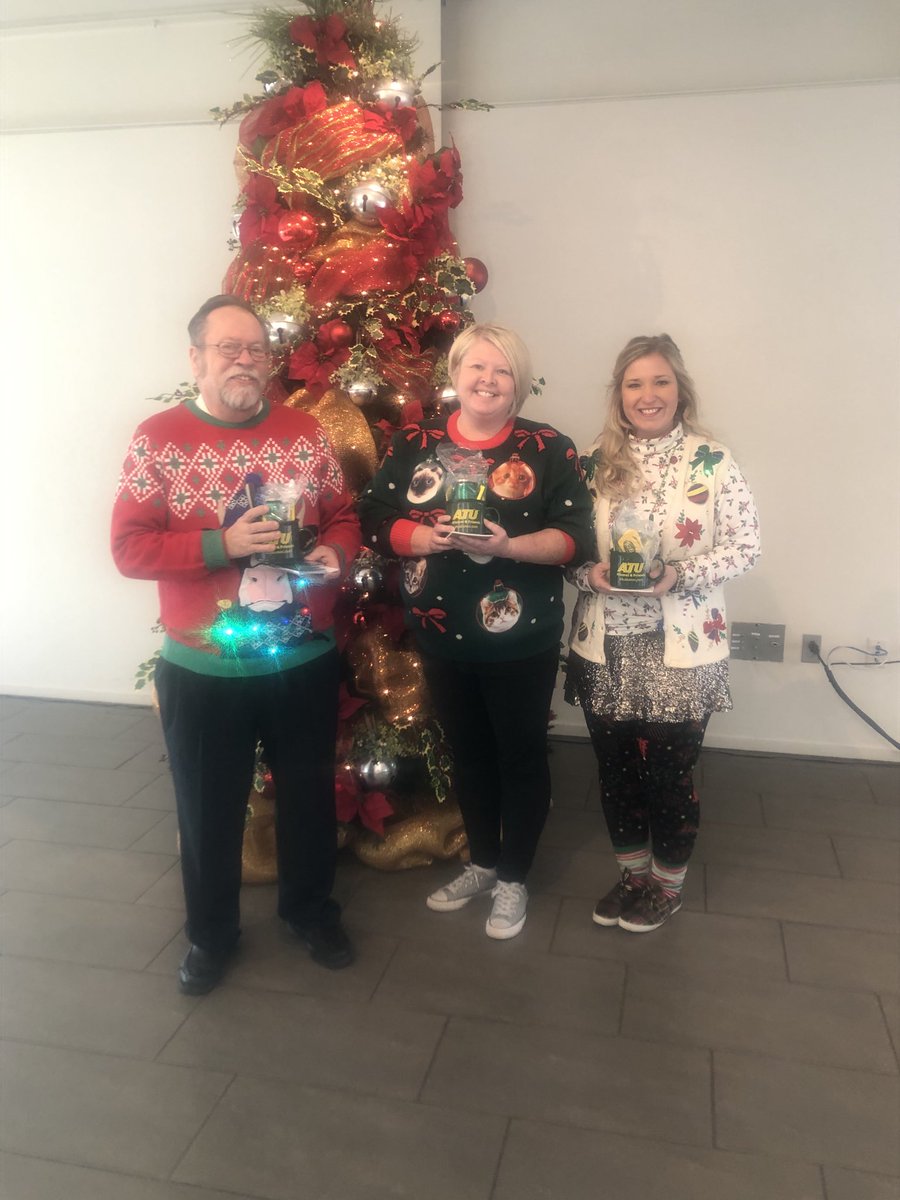 drrbowen's tweet photo. ⁦@ArkansasTech⁩ Annual Holiday Ugly Sweater Contest winners! 💚💛 Thank you to all faculty and staff who participated. Have a wonderful holiday break. https://t.co/Lgmdxnt2kC