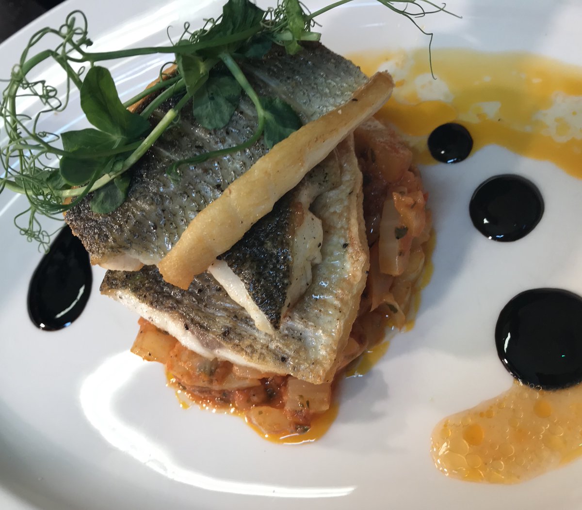 From our #Christmas menu. Pan fried sea bass fillet with fennel and garlic finished with a white wine and tomato sauce. #Delicious #ItalianFood #Italianrestaurantchester #ILoveItaly