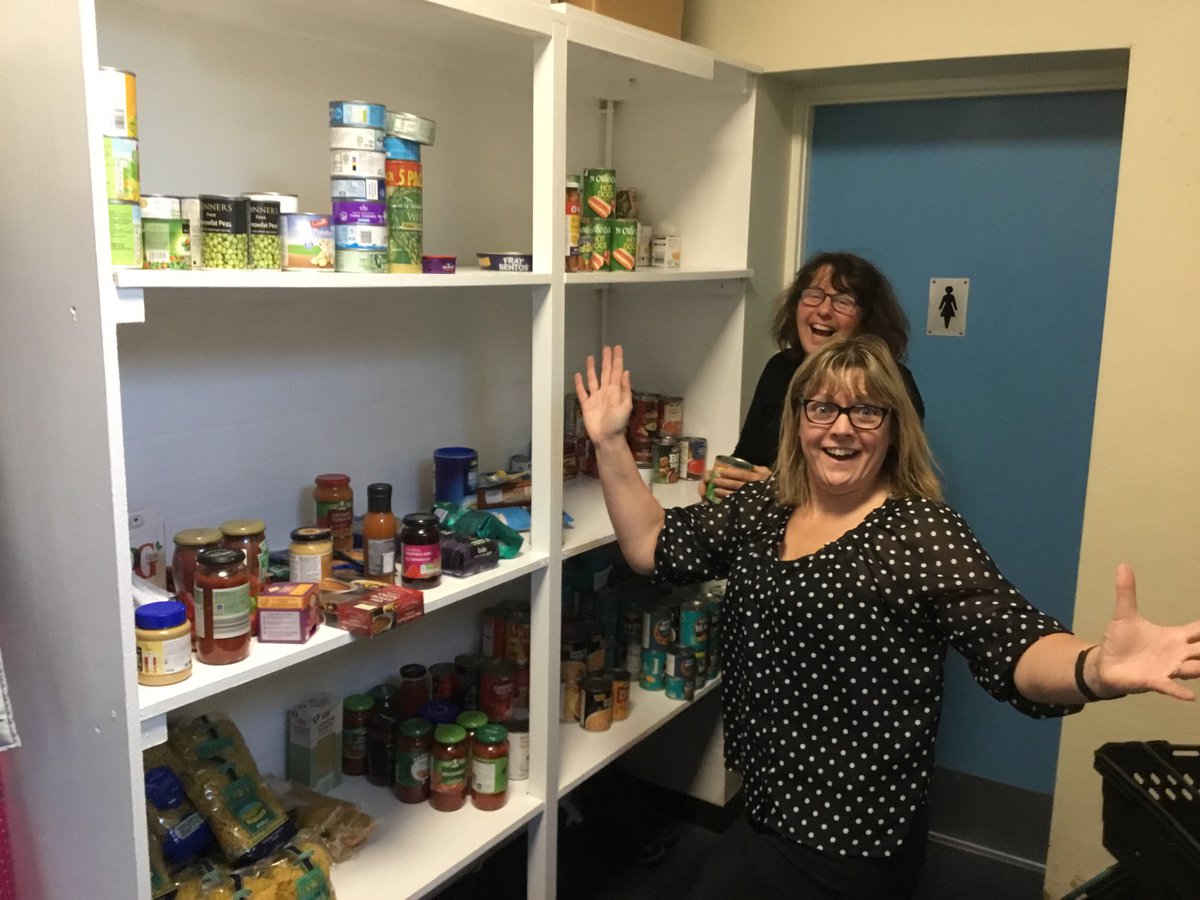 Mrs Young and Mrs Walker are really excited to be unpacking their first fare share shop. See you Friday morning parents. 5 items for £1 and a free cuppa. #onecommunity