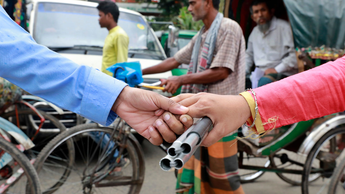 Visually impaired persons holding a walking stick together