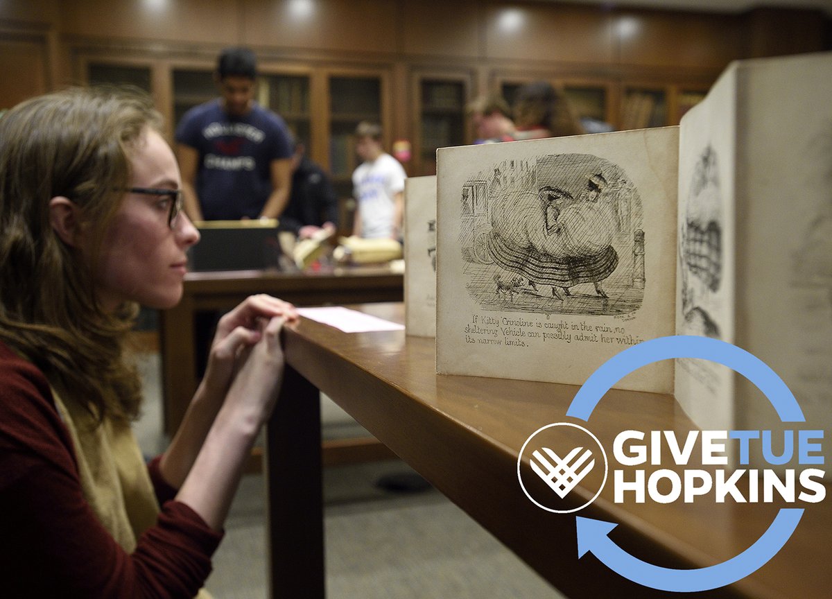 Student examining rare books in the Milton S. Eisenhower Library