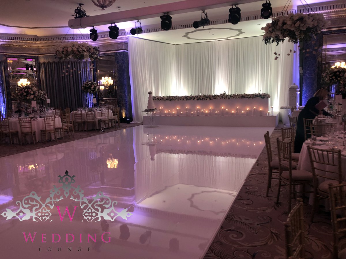 Dancefloor goals at the <a href="/TheDorchester/">The Dorchester</a> featuring our white seamless dancefloor, new white gloss head table, floating candles and white angled backdrop.