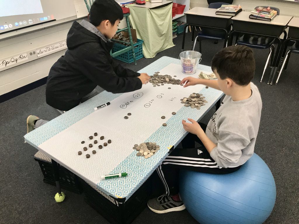 AnthonySchool's tweet photo. $223.15! Our students emptied their piggy banks and brought in a total of $223.15 today. Special thanks to these 5th graders for counting the money! You can join our students by donating today: https://t.co/PrsaaCZ3HK #GivingTuesdayKids #TAStudents #TAS75th #TheAnthonyCampaign https://t.co/buWDNBpGwN