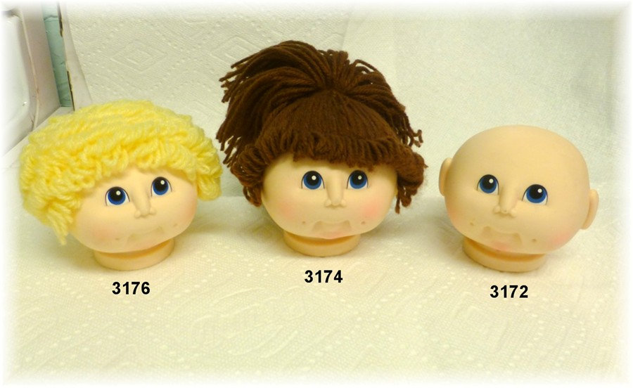 original little Doll Baby head by Martha Nelson Thomas w// red curly hair