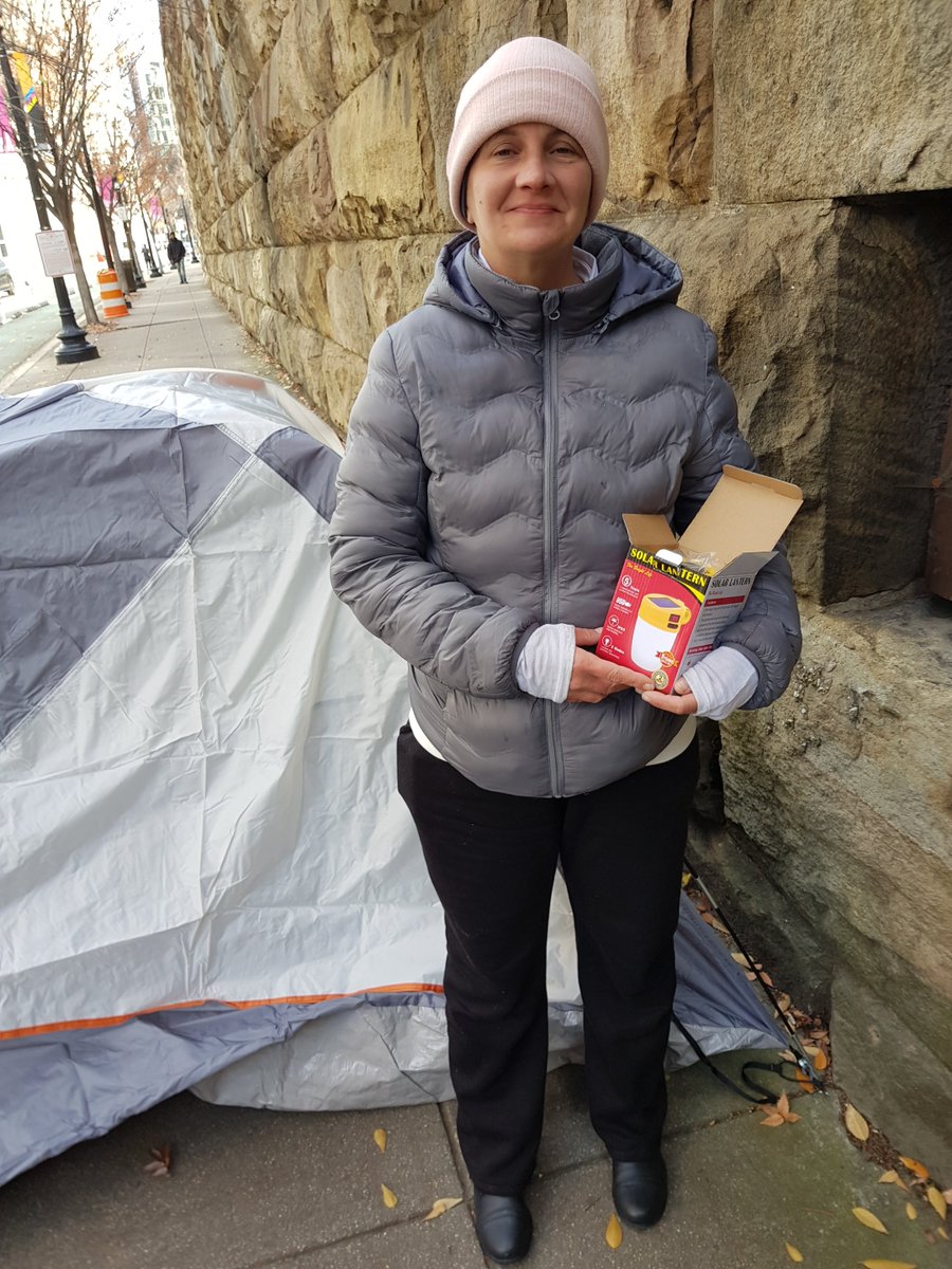 SolarEmpowers's tweet photo. I was coming home from a #CFC fundraising event when I saw this lady struggling to set up her tent. I helped her and also gave her a #SOLAR lantern as a tent-warming gift.  The lantern won’t actually warm her tent, but it will at least give her light in the night. #Homeless #DC https://t.co/UnNjJNbOdu