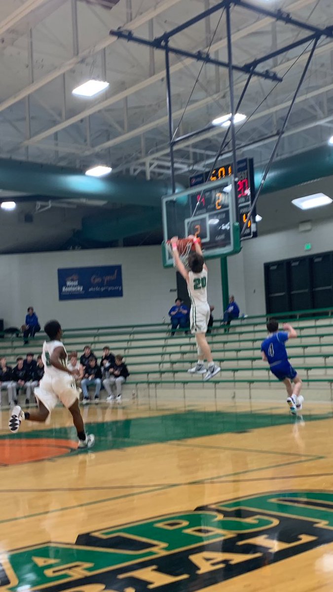 Brady Parrott with the slam off an assist from Donlow.  Pulled Bombers to within 4 in the 2nd quarter.  Photo courtesy Cari Holder.