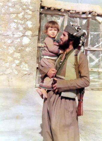A Peshmerga fighter with his daughter, southern Kurdistan