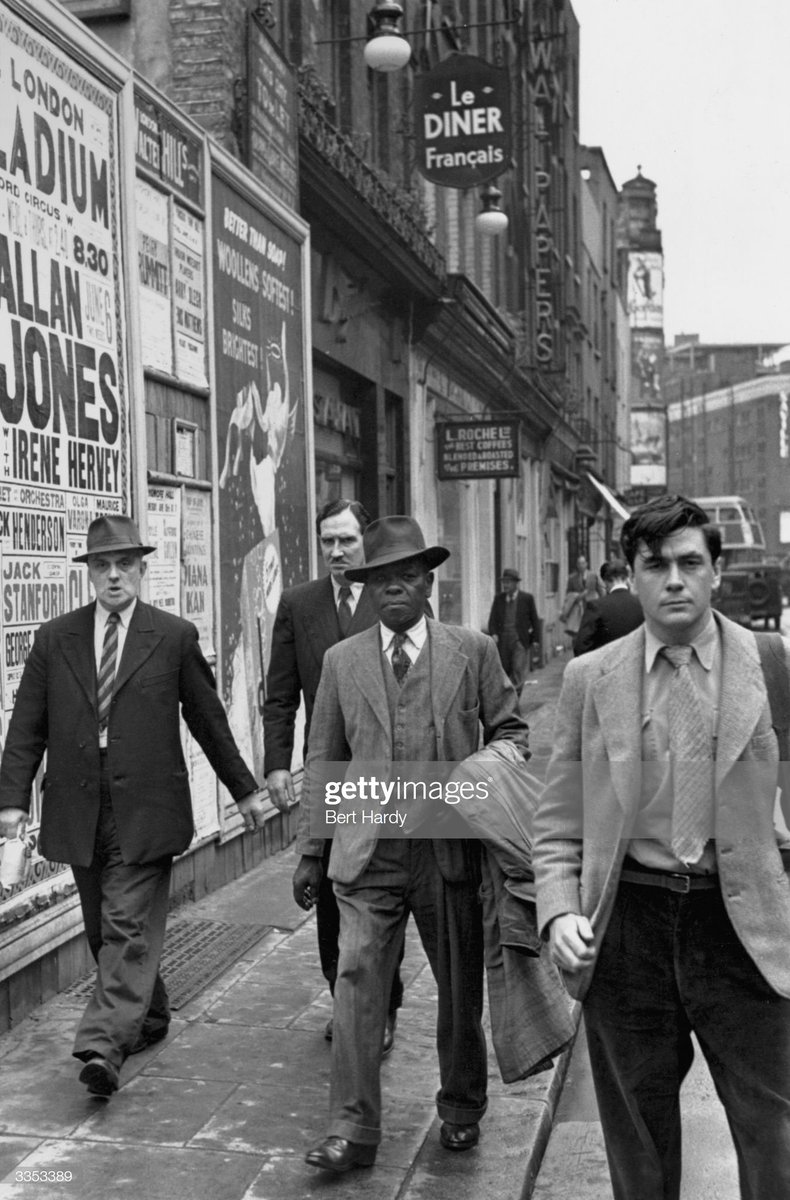 A West Indian man wandering around Soho in London, 1949. Photo by Bert Hardy