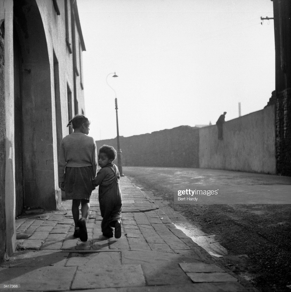 Children walk the streets in Bute Town, one of the poorest areas of Cardiff, 1954.Photo by Bert Hardy