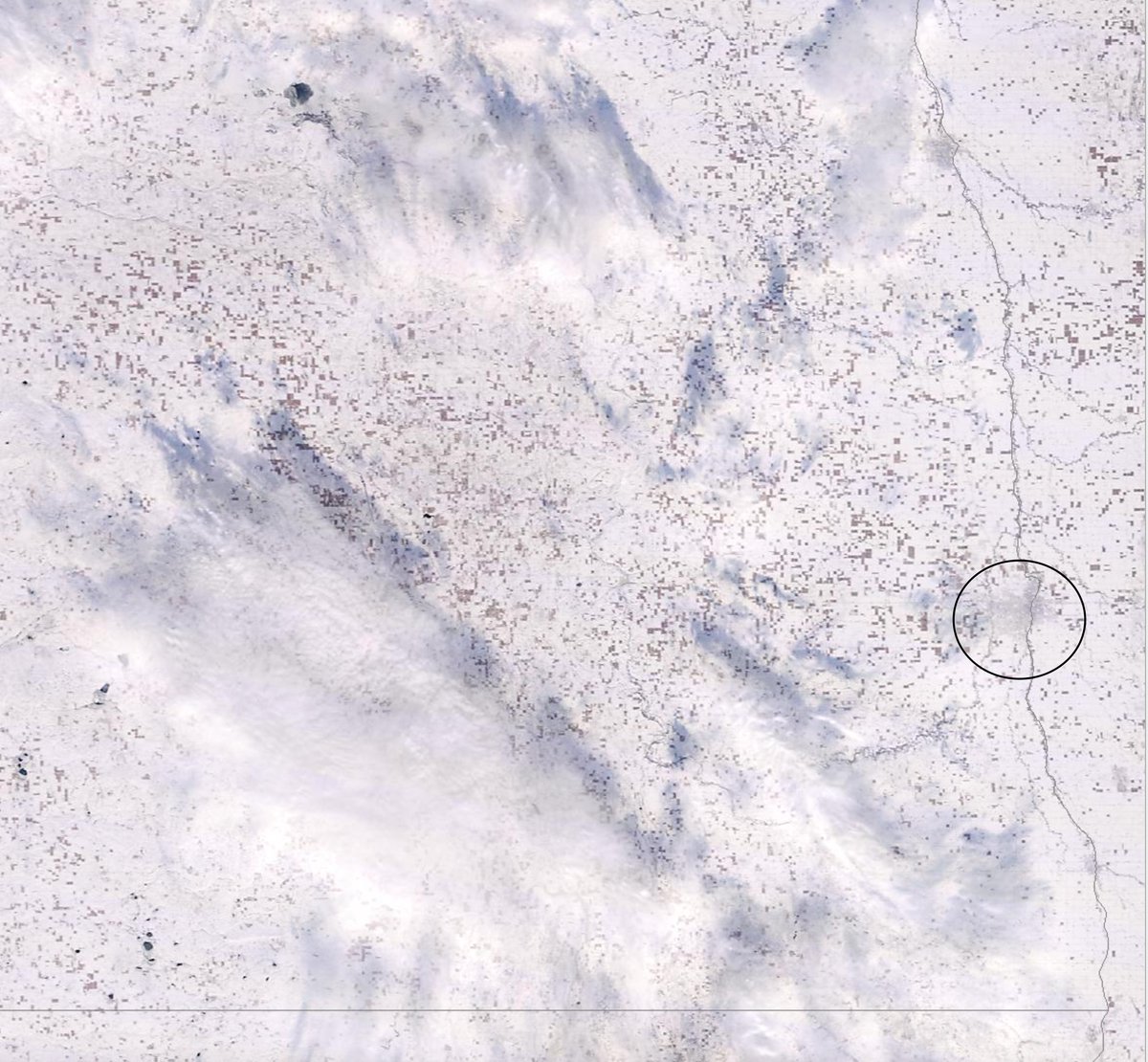 Satellite image from yesterday (250 meter resolution).  I circled Fargo for reference.  All the "brown" squares are corn still in the fields.  Some clouds/shadows in the image as well.