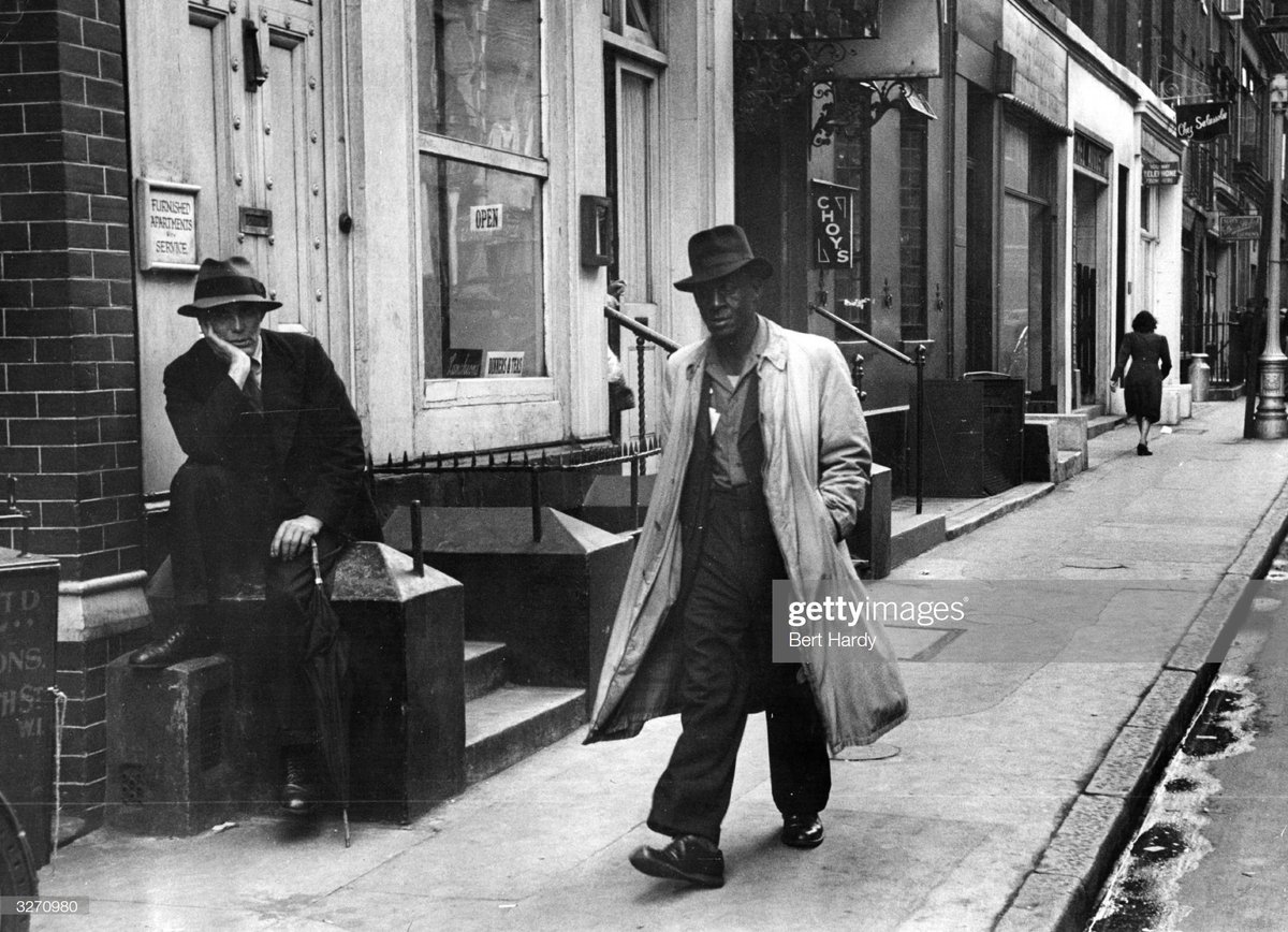 A man walking in a street in London, 1949. Photo by Bert Hardy