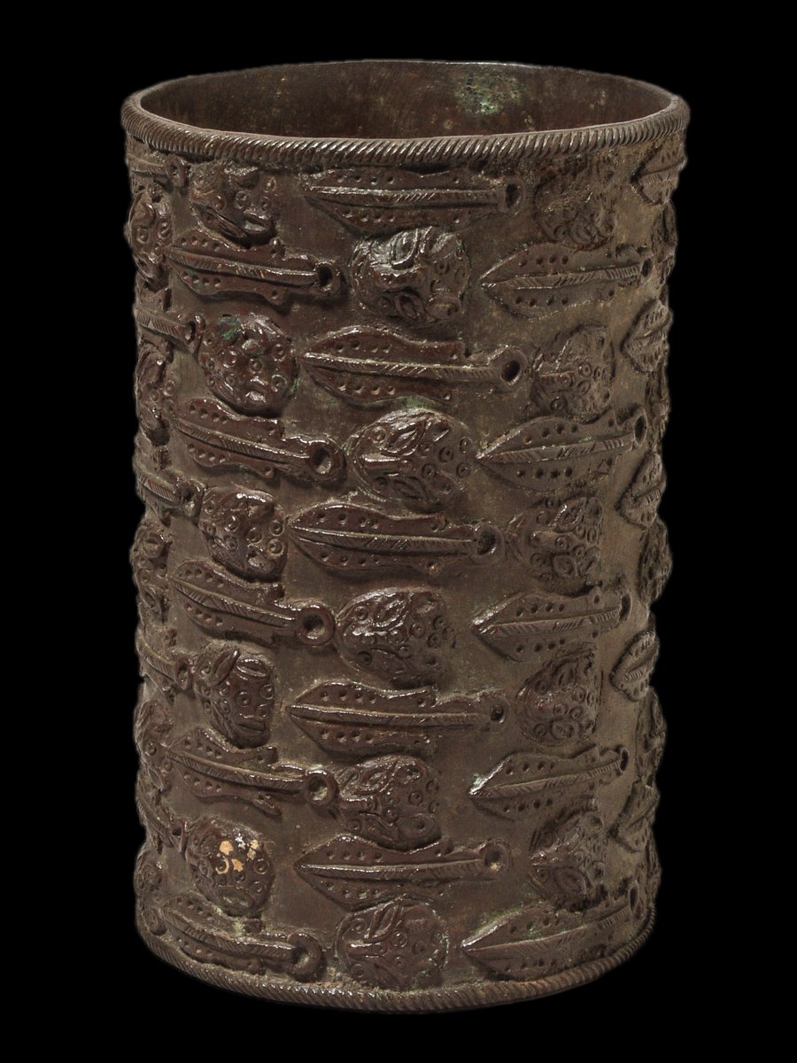 Cast brass armlet with relief design of 'eben' swords and leopard heads.  #BeninDisplays  @Pitt_Rivers  #Loot