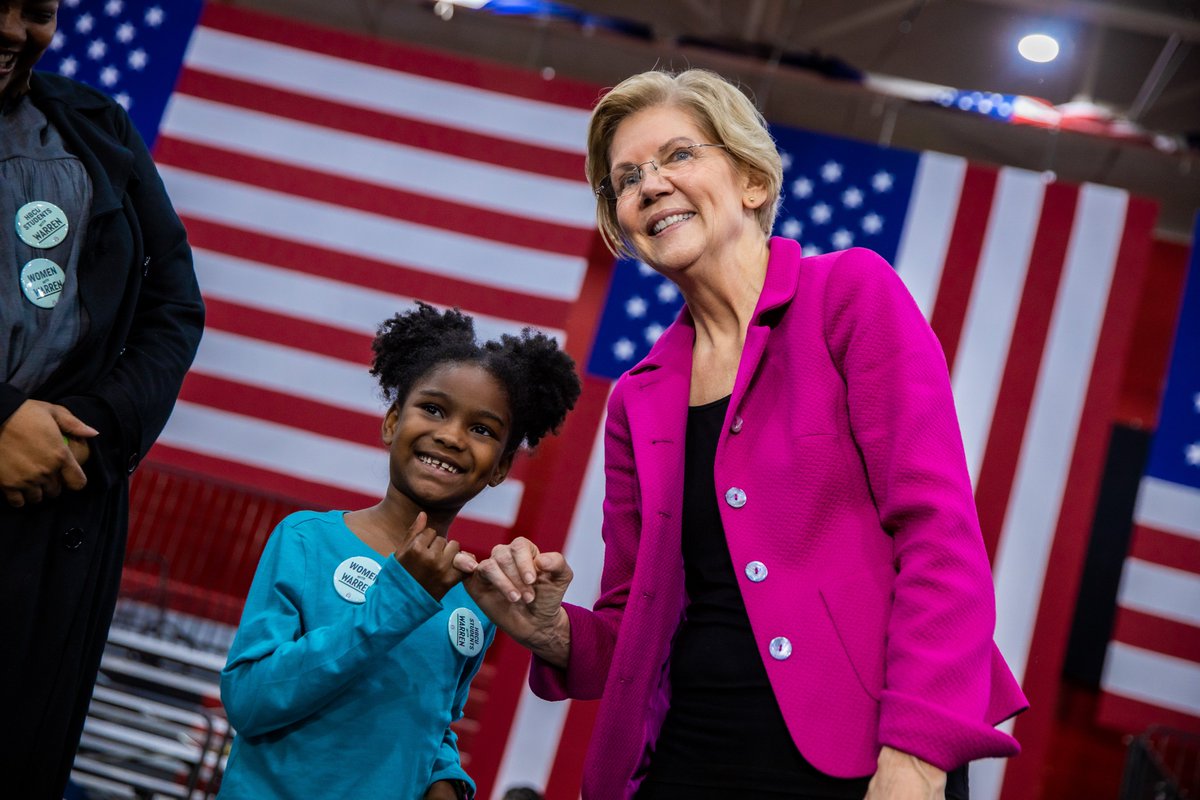 Elizabeth Warren makes a pinky promise with a pint-sized persister.