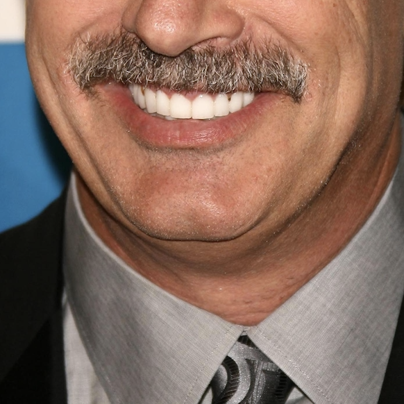 AdamsCheekDDS's tweet photo. This #CelebritySmile is one of the most well-known and trusted mental health professionals in the world, is the host of TV’s #1 daytime talk show, and has an iconic mustache to top it all off! Do you know which talk-show host this smile belongs to? https://t.co/wpJw1h4S5K
