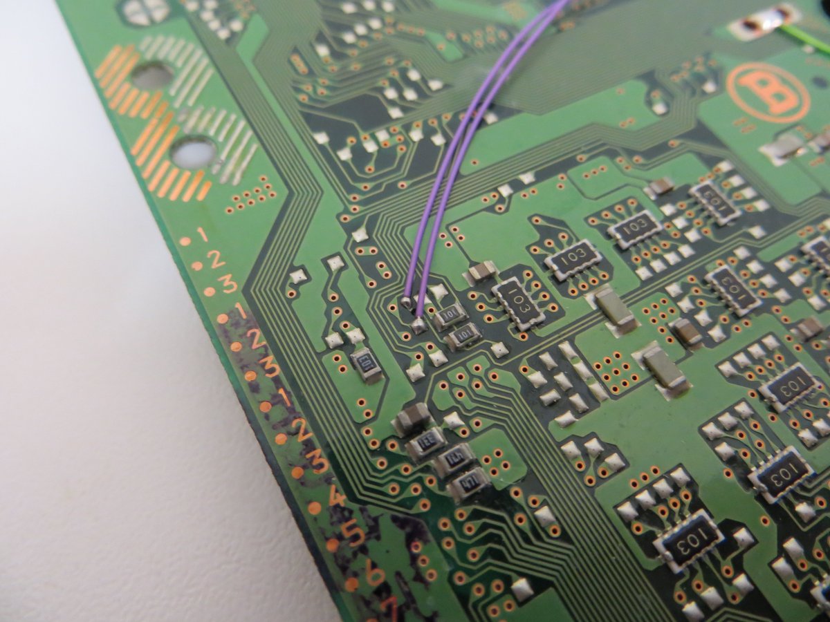 ConsoleMods's tweet photo. SCPH-1002 PU-8 #PlayStation #PSIO switchboard install &amp; modchip rewire. Why do 90% of modchip installs from the 90's look like utter garbage? Brittle solder, pad hanging on by a thread, tape, plus three missing board screws. #ConsoleMods #ConsoleModding ##PS1O #PS1 #CybdynSystems https://t.co/aeiEfXnJQ2