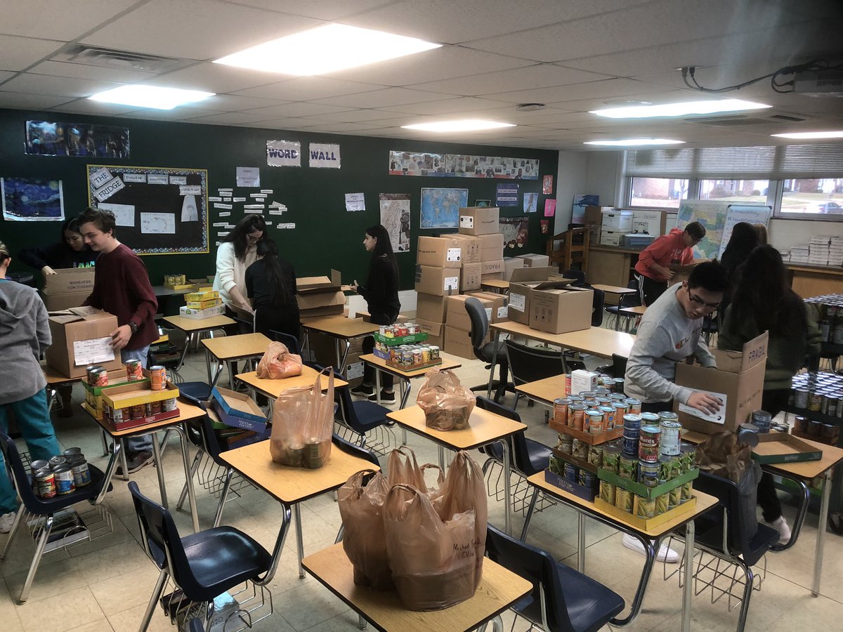 BaylessNHS's tweet photo. Counting cans - thanks to all who donated, we beat last year’s totals! Stay tuned to hear which class, and which advisory, won the competition for spirit points and a catered lunch! #baylessgood #cannedfooddrive #SeasonofGiving https://t.co/Y30KKJXoiM
